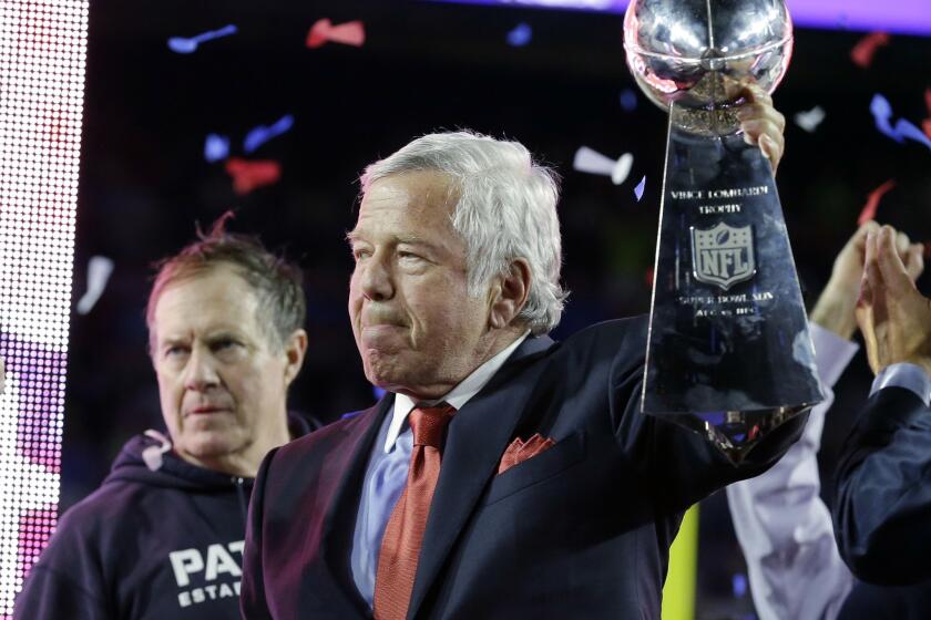 Patriots owner Robert Kraft accepts the Vince Lombardi Trophy as NFL champions following the 28-24 win over the Seahawks.