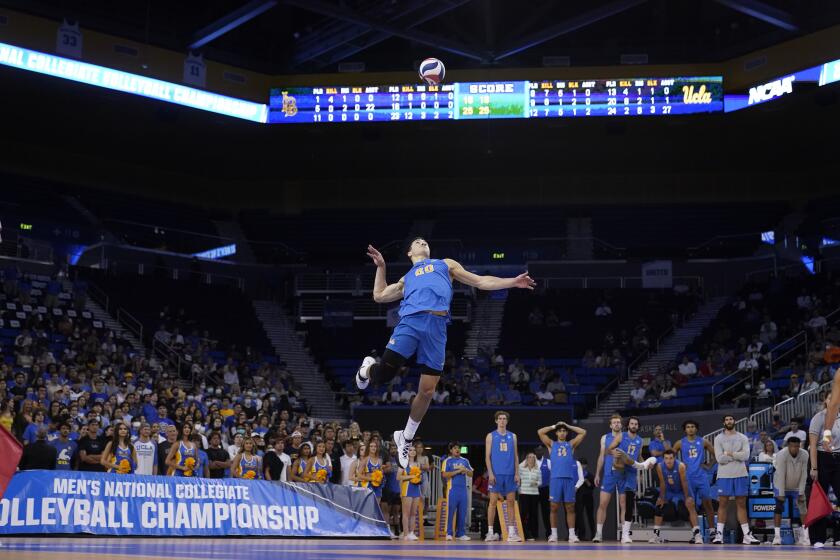 UCLA outside hitter Ethan Champlin serves to Long Beach State during last year's NCAA tournament semifinal 