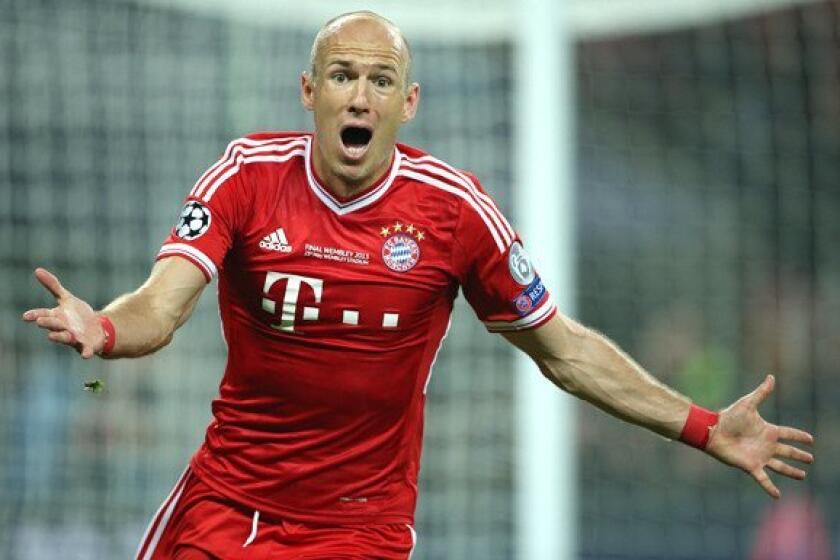 Bayern Munich's Arjen Robben celebrates after scoring what proved to be the winning goal in a 2-1 victory over Borussia Dortmund in the UEFA Champions League final on Saturday afternoon at Wembley Stadium.