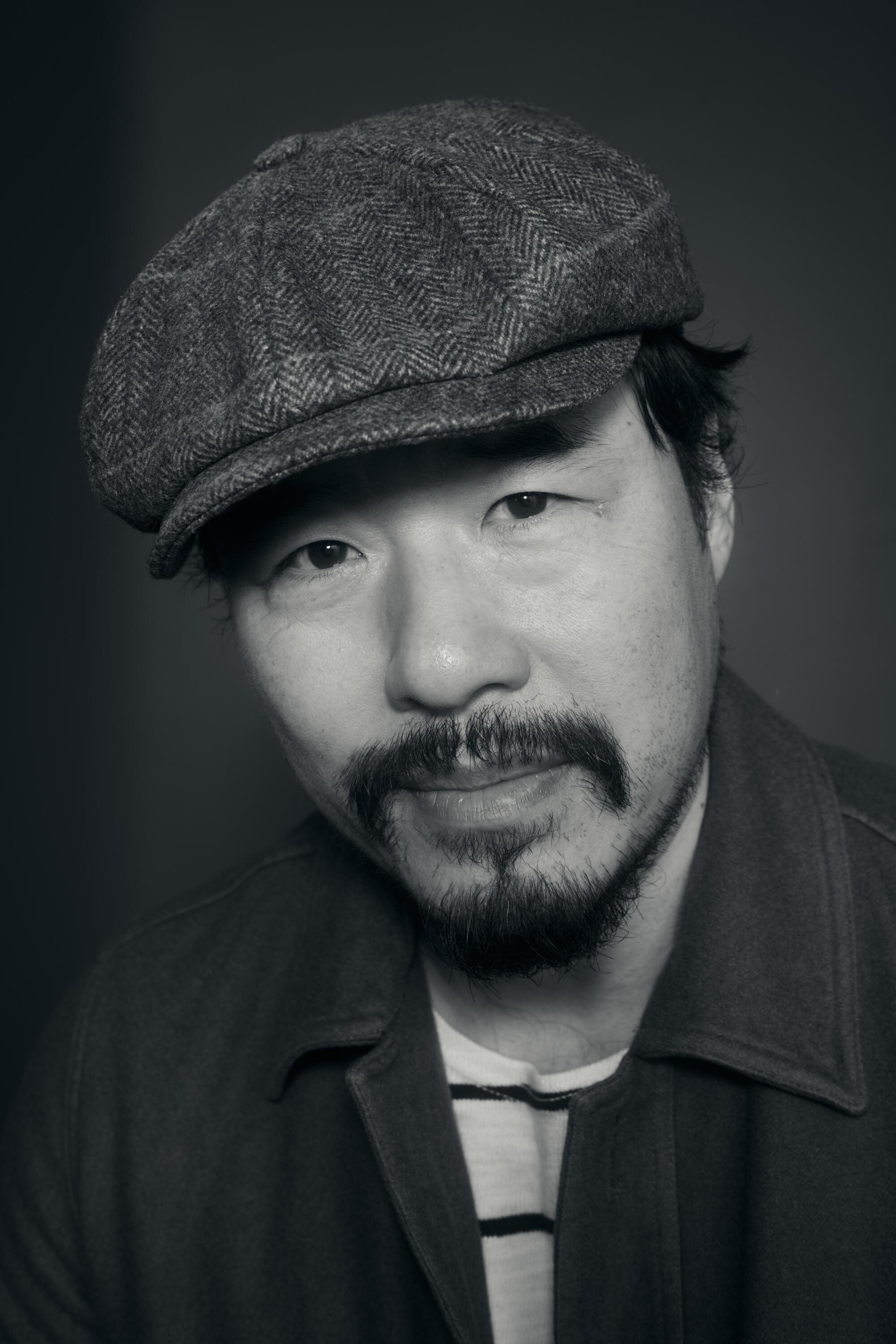 Randall Park in a hat.