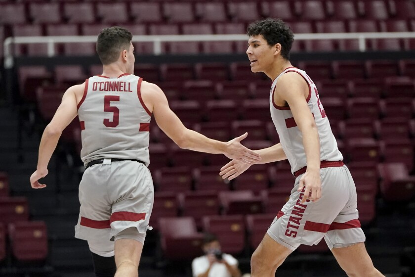 Stanford guard Michael O'Connell (5) celebrates with forward Brandon Angel during the second half of the team's NCAA college basketball game against Arizona State in Stanford, Calif., Saturday, Jan. 22, 2022. (AP Photo/Jeff Chiu)