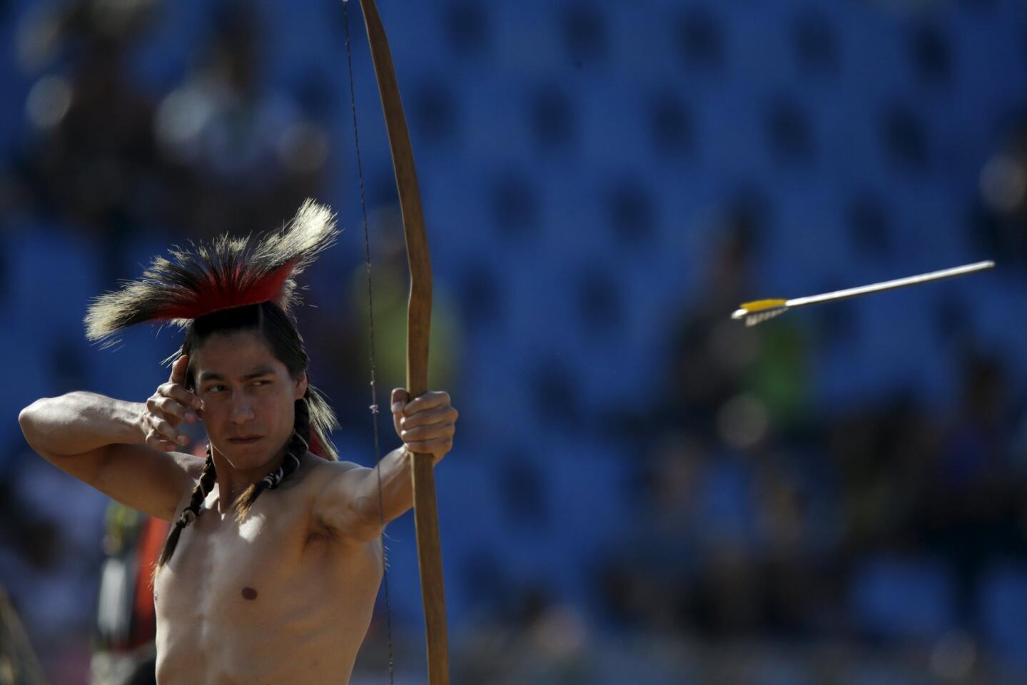 An indigenous man from the U.S. fires an arrow during the bow-and-arrow competition at the first World Games for Indigenous Peoples in Palmas