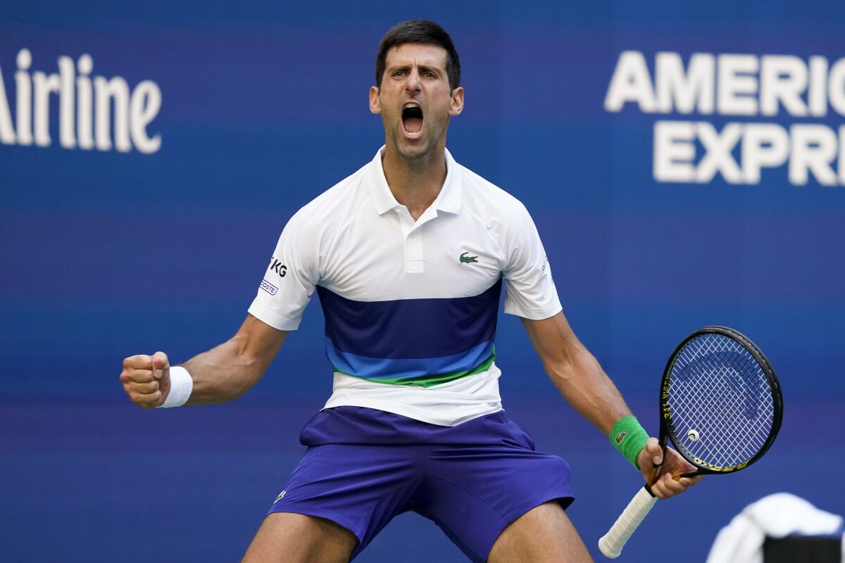 Novak Djokovic reacts after scoring a point against Kei Nishikori.
