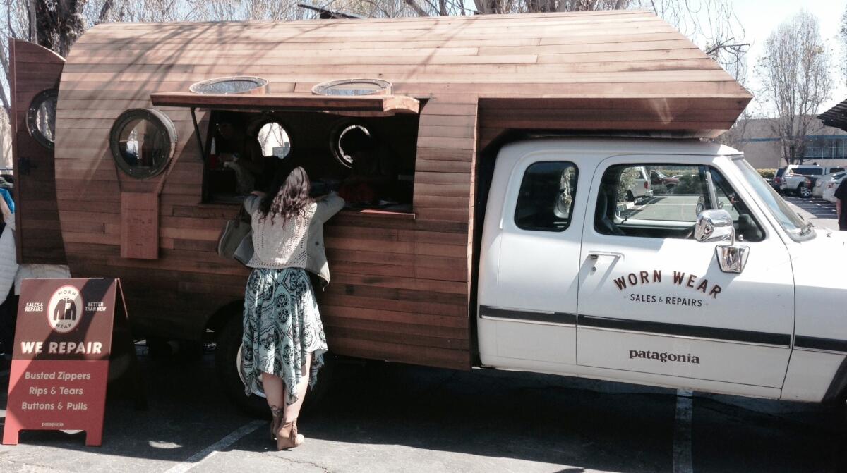 A converted biodiesel truck outfitted with industrial sewing machines sits in the parking lot of Patagonia's Ventura headquarters. On Saturday it will kick off a cross-country mobile repair tour in San Franciso.