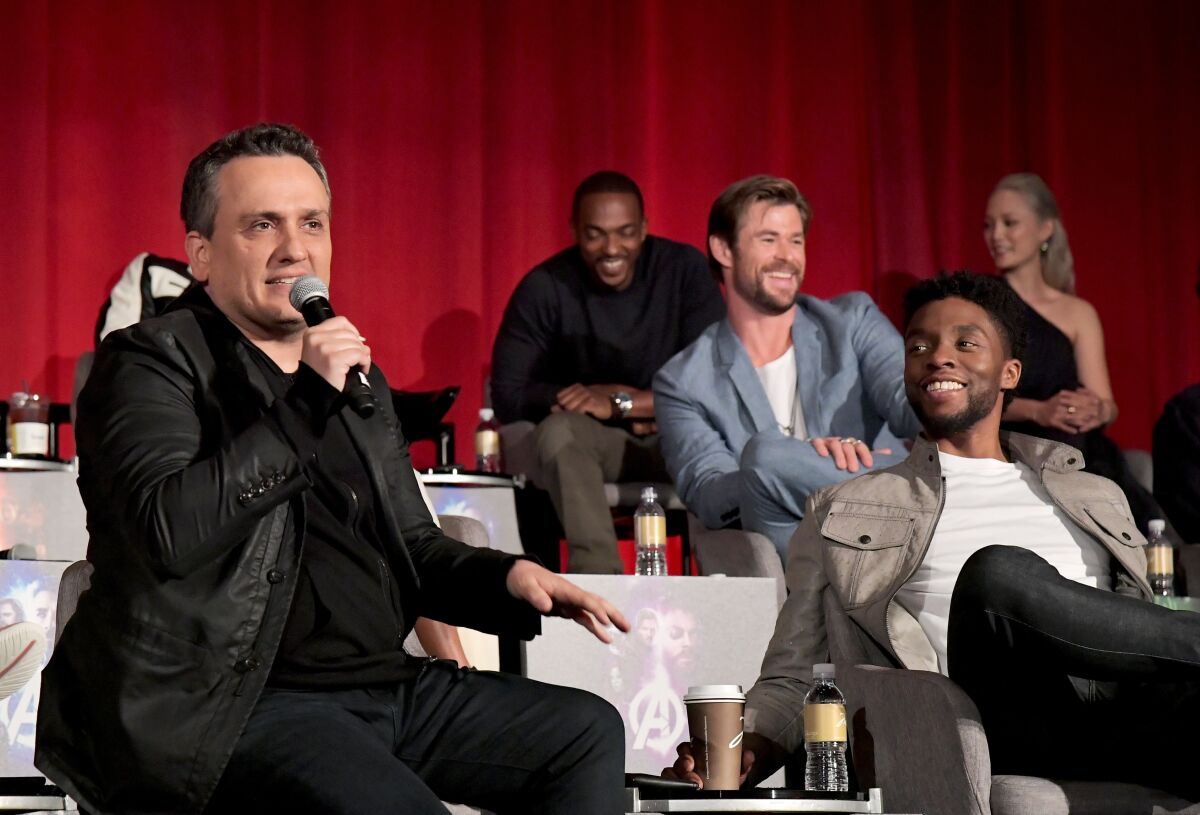 Director Joe Russo, left, and Chadwick Boseman at a news conference for "Avengers: Infinity War" in Los Angeles in April 2018.