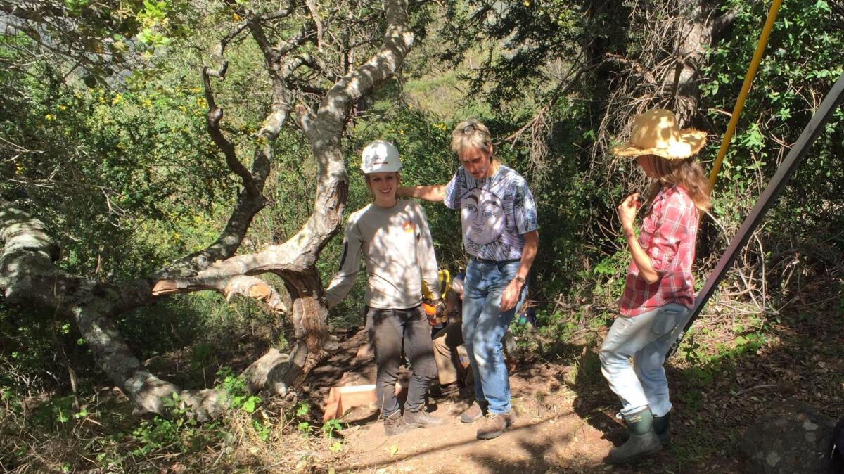Big Sur residents are helping build a foot trail around a downed bridge. From left, wildlife biologist Amy List with Carissa Chappellet and her cousin, Heather Chappellet.