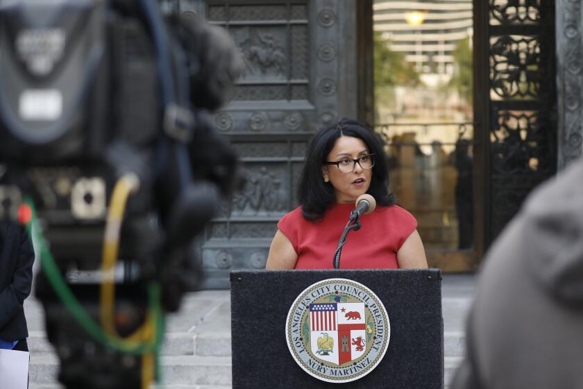 LOS ANGELES, CA - SEPTEMBER 29: Los Angeles Council President Nury Martinez, at the podium and is joined by L.A. County Board of Supervisors Chair Hilda Solis and L.A. County Public Health Director Barbara Ferrer to hold a news conference ahead of the City Council's vote to create a citywide vaccine mandate for people entering many indoor public spaces. The ordinance, introduced by Council President Martinez and Councilmember Mitch O'Farrell, would require eligible individuals to be vaccinated to enter indoor public spaces, including but not limited to restaurants, bars, nightclubs, gyms, sports arenas, museums, spas, nail salons, all indoor City facilities and more. The City's ordinance aligns with the Los Angeles County Department of Health's order and expands on the restrictions to include more indoor settings and businesses, as well as establishes guidelines for Outdoor Large Events (5,000 to 9,999 persons). Both the Department of Public Health and the Department of Building and Safety will enforce this mandate. City Hall on Wednesday, Sept. 29, 2021 in Los Angeles, CA. (Al Seib / Los Angeles Times).