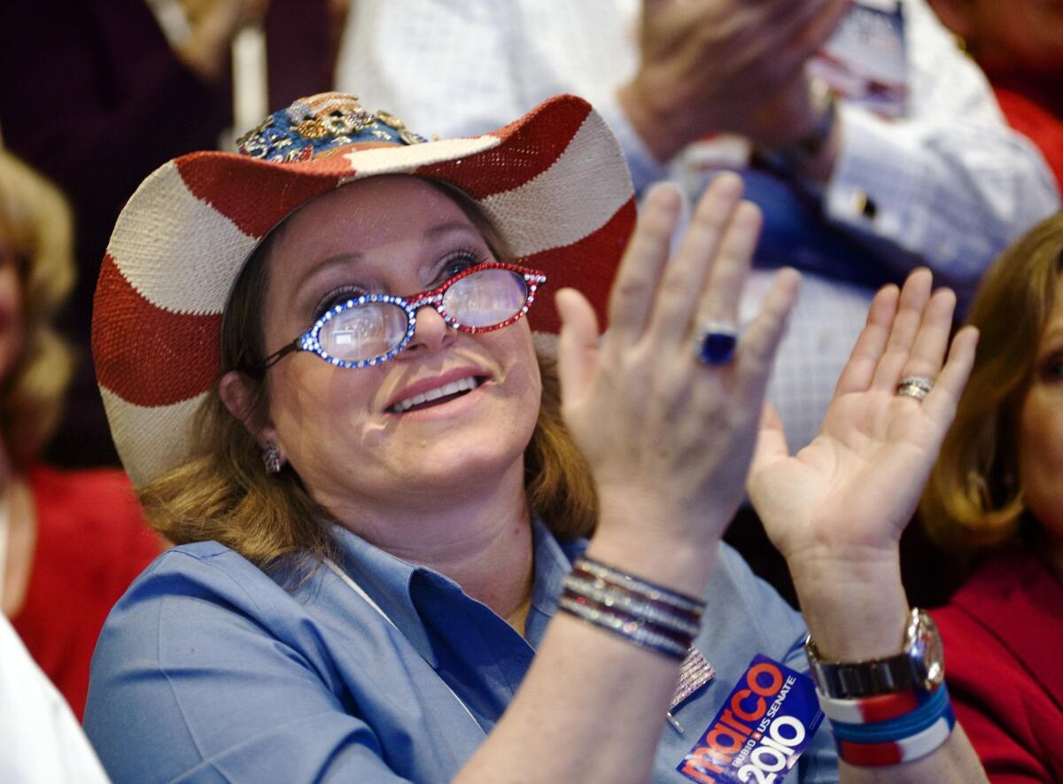 An attendee applauds a keynote speech at the 2010 Conservative Political Action Conference.