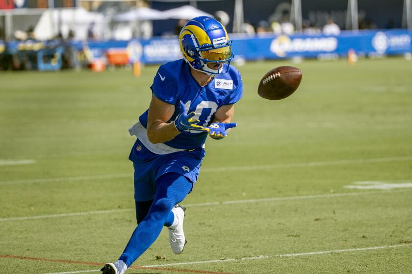 IRVINE, CA - JULY 28, 2021: Rams wide receiver Cooper Kupp (10) pulls in a pass on the first da.