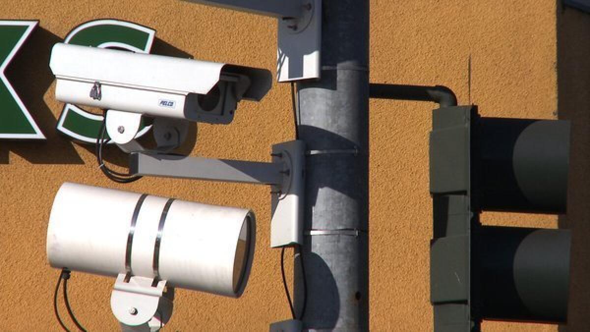 Increasingly, cameras connected to home and public Internet networks are being used by consumers in their homes. Above, a camera at a Los Angeles intersection snaps photos of drivers suspected of running red lights.
