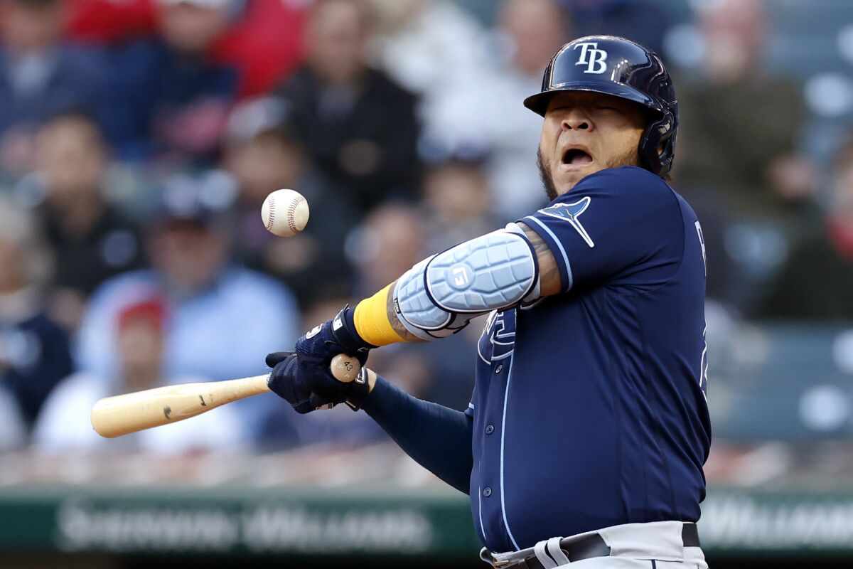 Tampa Bay Rays' Harold Ramirez reacts after being hit by a pitch from Cleveland Guardians starter Cal Quantrill during the first inning of a baseball game Thursday, Sept. 29, 2022, in Cleveland. (AP Photo/Ron Schwane)