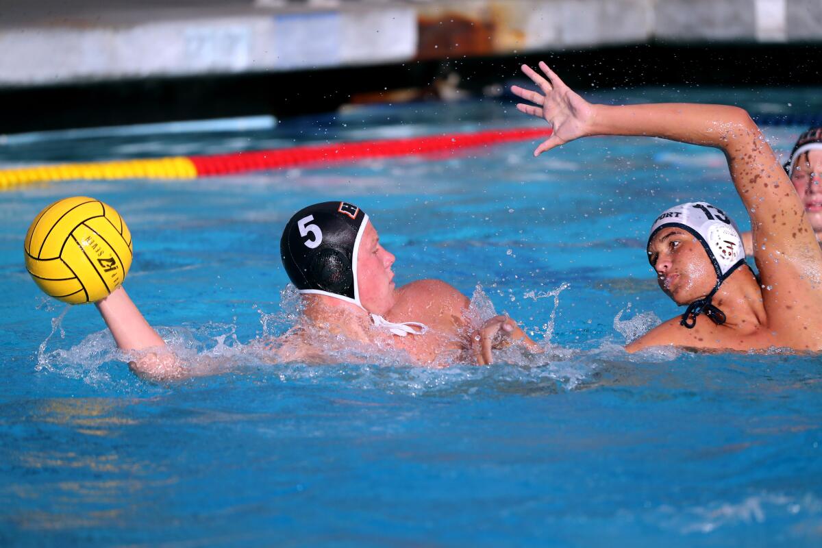 Chase Dodd, left, and Ben Liechty are shown playing against each other in high school in March 2021. 