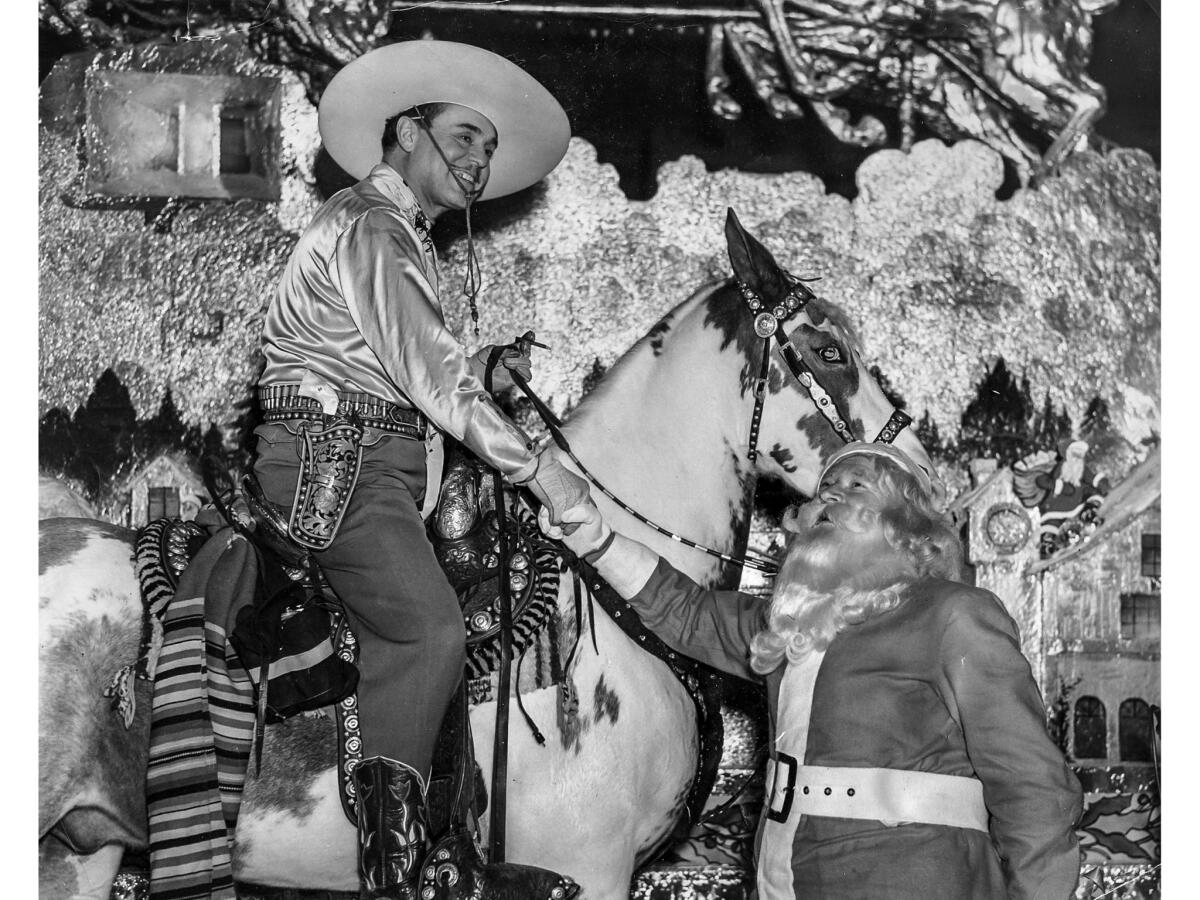 Nov. 27, 1937: Santa Claus welcomes actor Leo Carrillo to Santa Claus Lane in Hollywood.