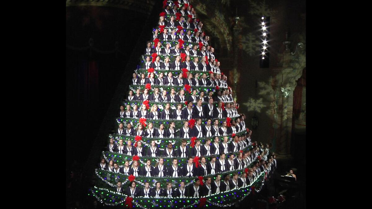 Yes, this Christmas tree is made of people, specifically members of the Mona Shores High School Choir from western Michigan.