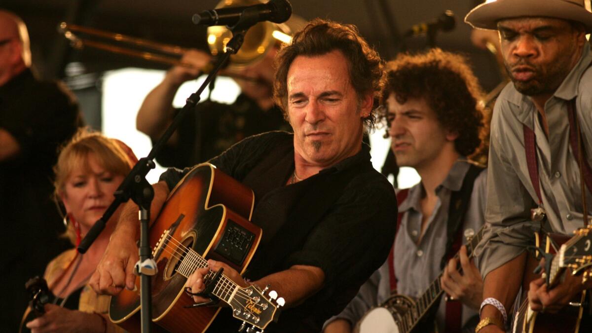 Bruce Springsteen performs with the Seeger Sessions Band at the 2006 New Orleans Jazz & Heritage Festival.