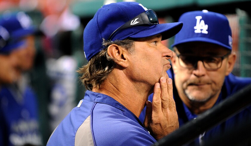 Dodgers Manager Don Mattingly reacts after ace Clayton Kershaw gives up a three-run home run to Cardinals first baseman Matt Adams in Game 4 of the NLDS on Tuesday in St. Louis.