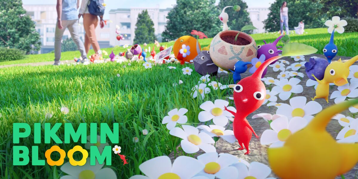 Image of the game "Pikmin Bloom," with characters playing on a field of grass