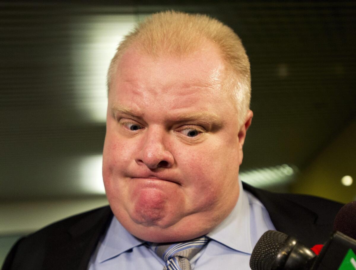 Toronto Mayor Rob Ford addresses reporters outside his office Thursday after revelation of another embarrassing video, this one showing him drunk, ranting and threatening to kill someone.
