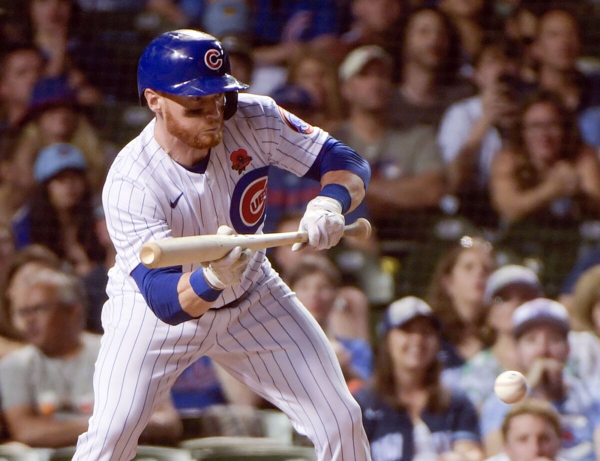 FILE - Chicago Cubs' Clint Frazier bunts against the Milwaukee Brewers, May 30, 2022, at Wrigley Field in Chicago. Frazier was designated for assignment in a surprise decision by the Cubs, who also placed pitcher Marcus Stroman on the 15-day injured list with right shoulder inflammation as part of a flurry of roster moves Friday, June 10, 2022. (AP Photo/Mark Black, File)
