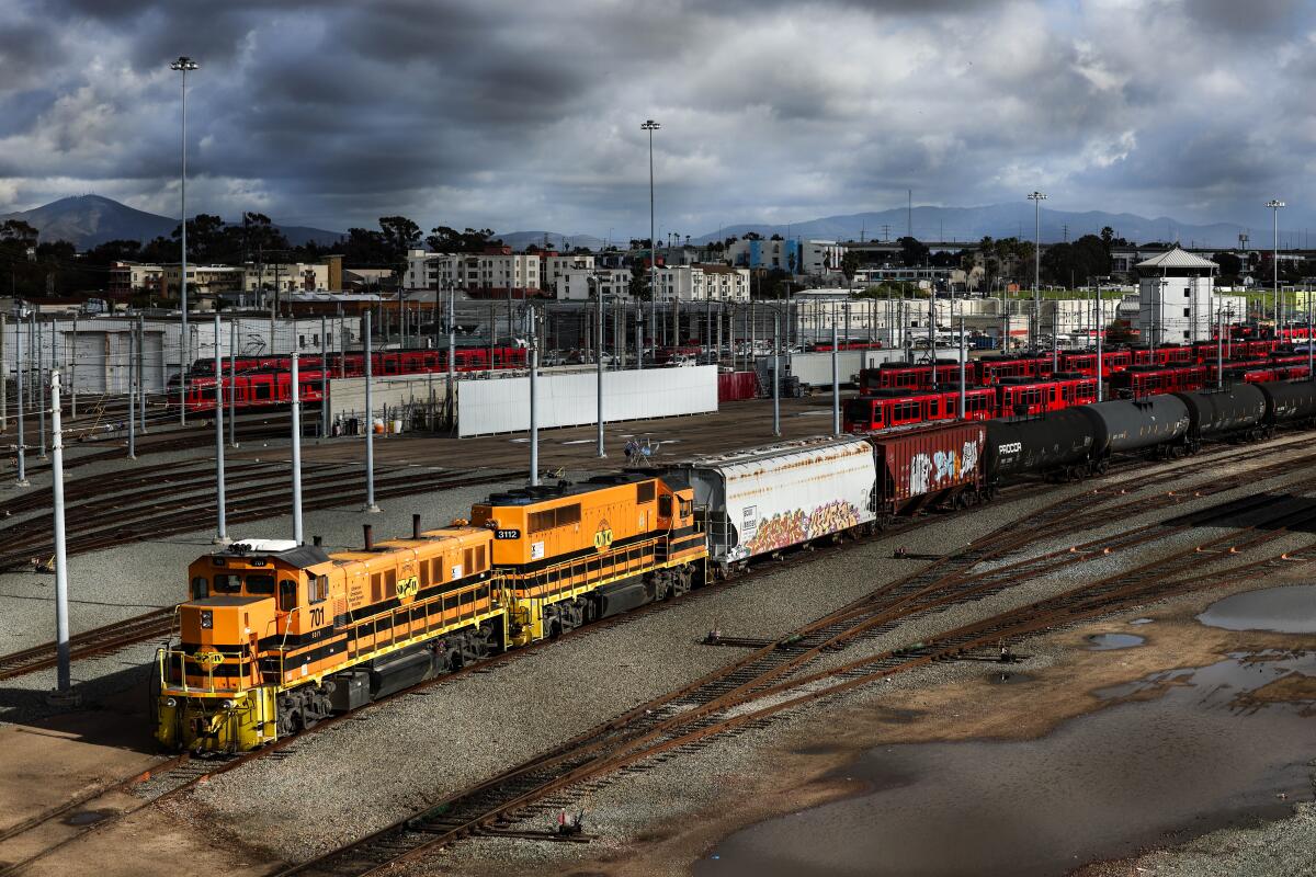 A freight train passes through San Diego on Friday.