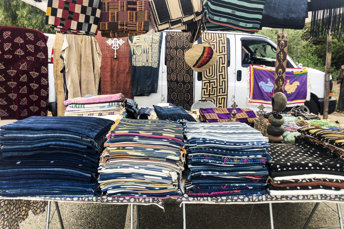 Blankets and carpets from Africa at an outdoor stall 