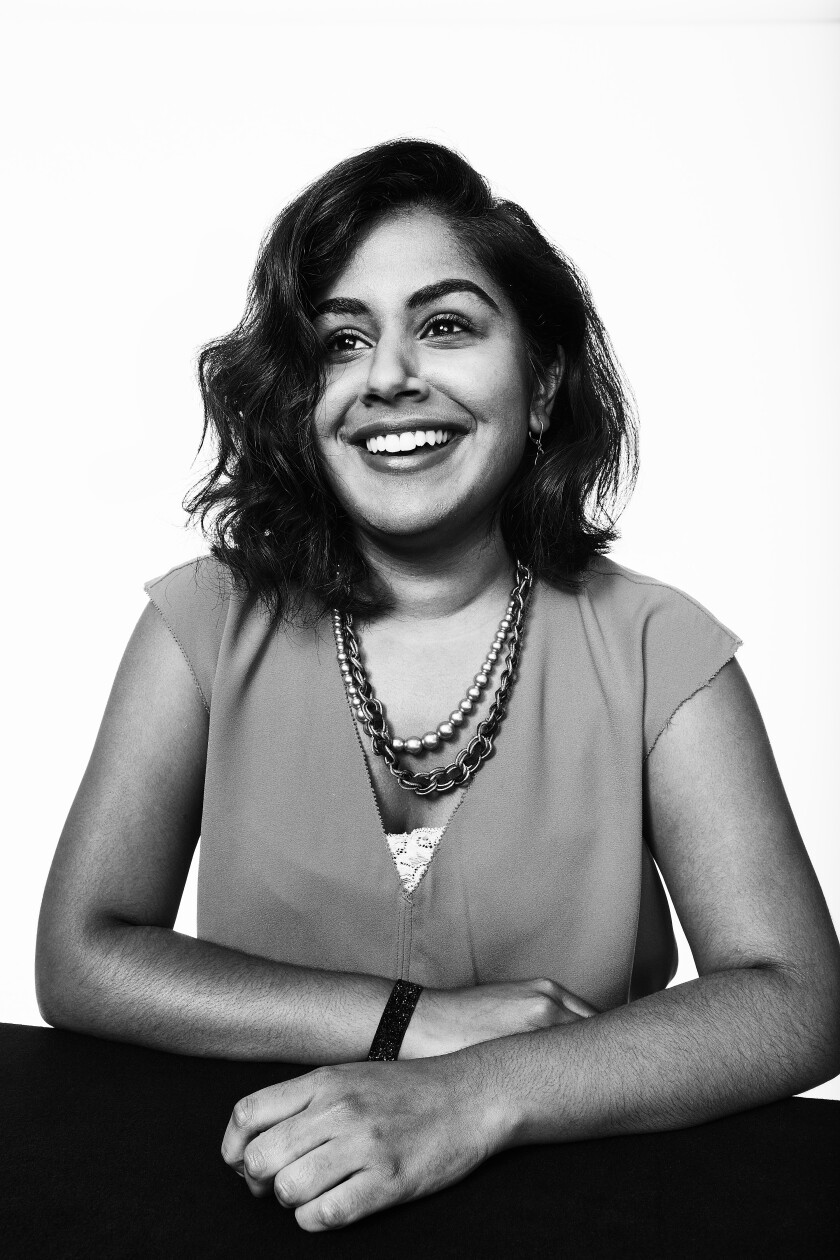 A photo portrait of a smiling Elena Gooray.