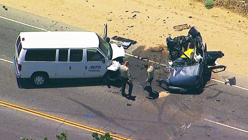 This still image taken from video provided by KABC-TV shows the scene of a collision between a passenger van and a car in Palmdale late Tuesday morning.