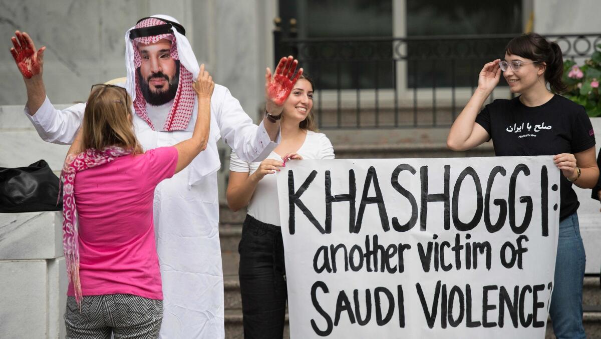 A demonstrator dressed as Saudi Arabian Crown Prince Mohammed bin Salman protests outside the Saudi Embassy in Washington on Monday.8.