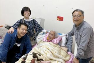 Columnist Frank Shyong visiting his grandma on Lunar New Year in 2020..