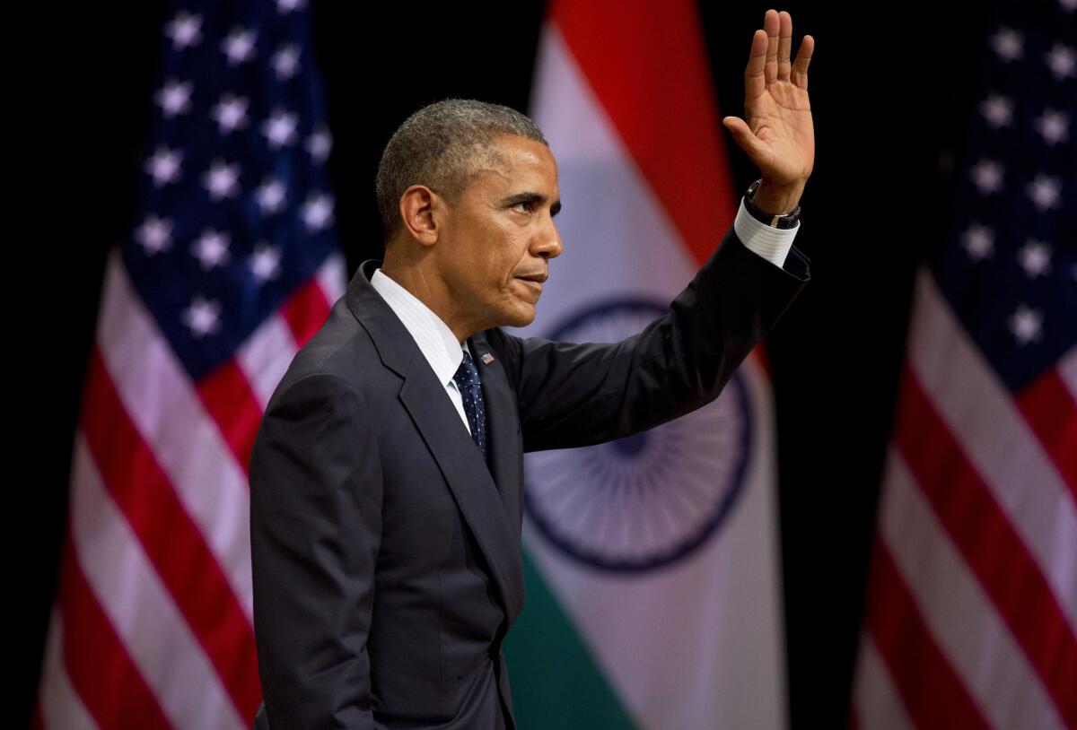 President Obama waves to the audience after delivering a speech in New Delhi on Jan. 27.