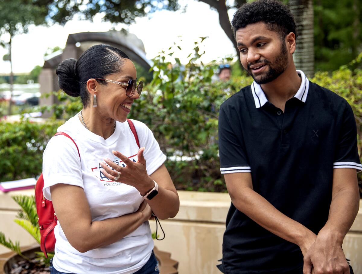 Florida Attorney General candidate Aramis Ayala talks with Congressional candidate Maxwell Frost