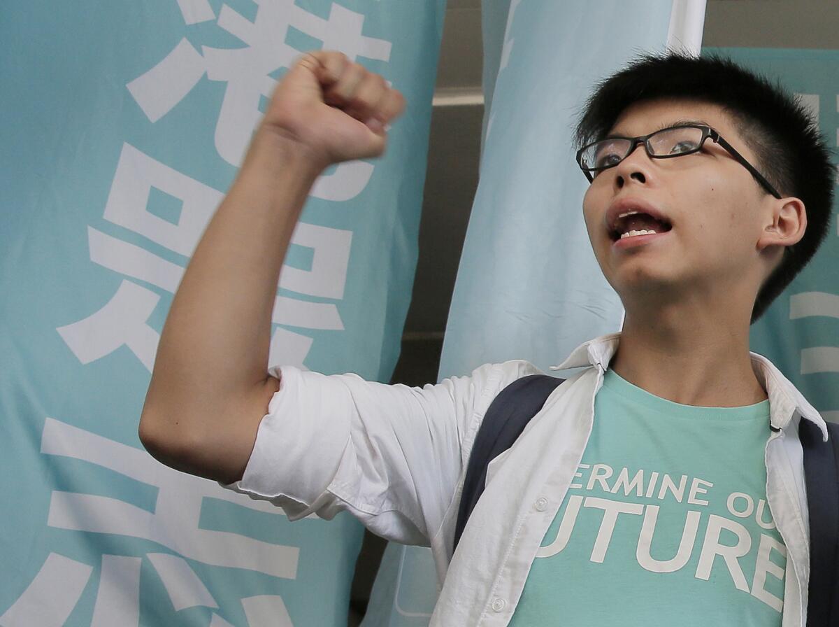 Teen protest leader Joshua Wong outside the magistrate's court in Hong Kong, where he was found guilty of taking part in an illegal rally that sparked massive pro-democracy protests two years ago.