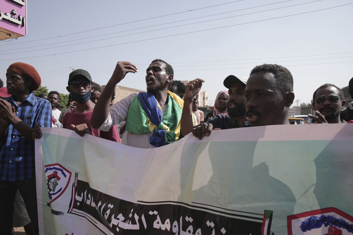People chant slogans during a protest in Khartoum, amid ongoing demonstrations against a military takeover in Khartoum, Sudan, Thursday, Nov. 4, 2021. (AP Photo/Marwan Ali)
