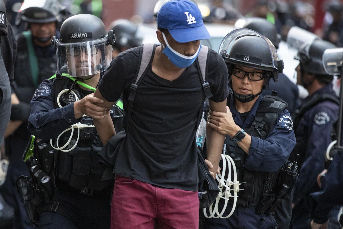 Dozens of protesters are arrested June 2 for curfew violations in Los Angeles.