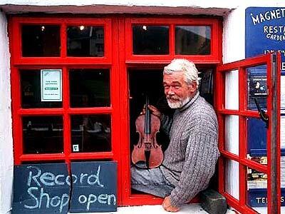 Mike King and fiddle at Magnetic Music in tiny downtown Doolin.
