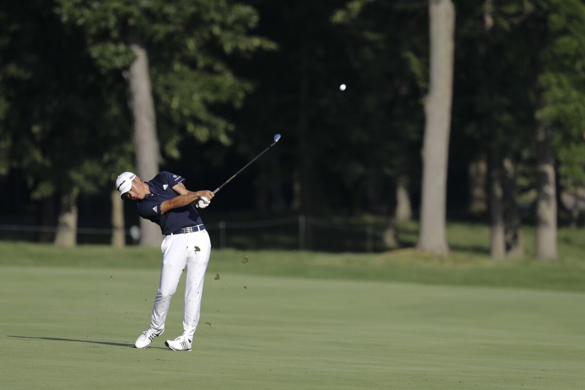 Coilin Morikawa hits on the 13th hole during the second round of the Workday Charity Open golf tournament, Friday, July 10, 2020, in Dublin, Ohio. (AP Photo/Darron Cummings)