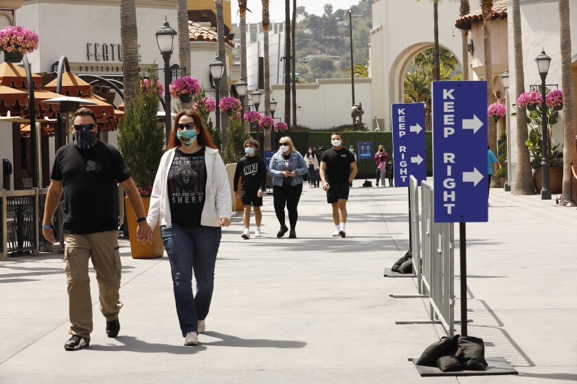 Guests walk in Universal Studios Hollywood.