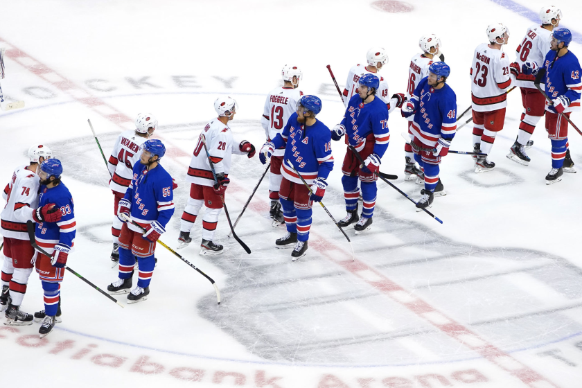 Members of the Carolina Hurricanes and New York Rangers at the conclusion of their Stanley Cup playoff series Aug. 4.