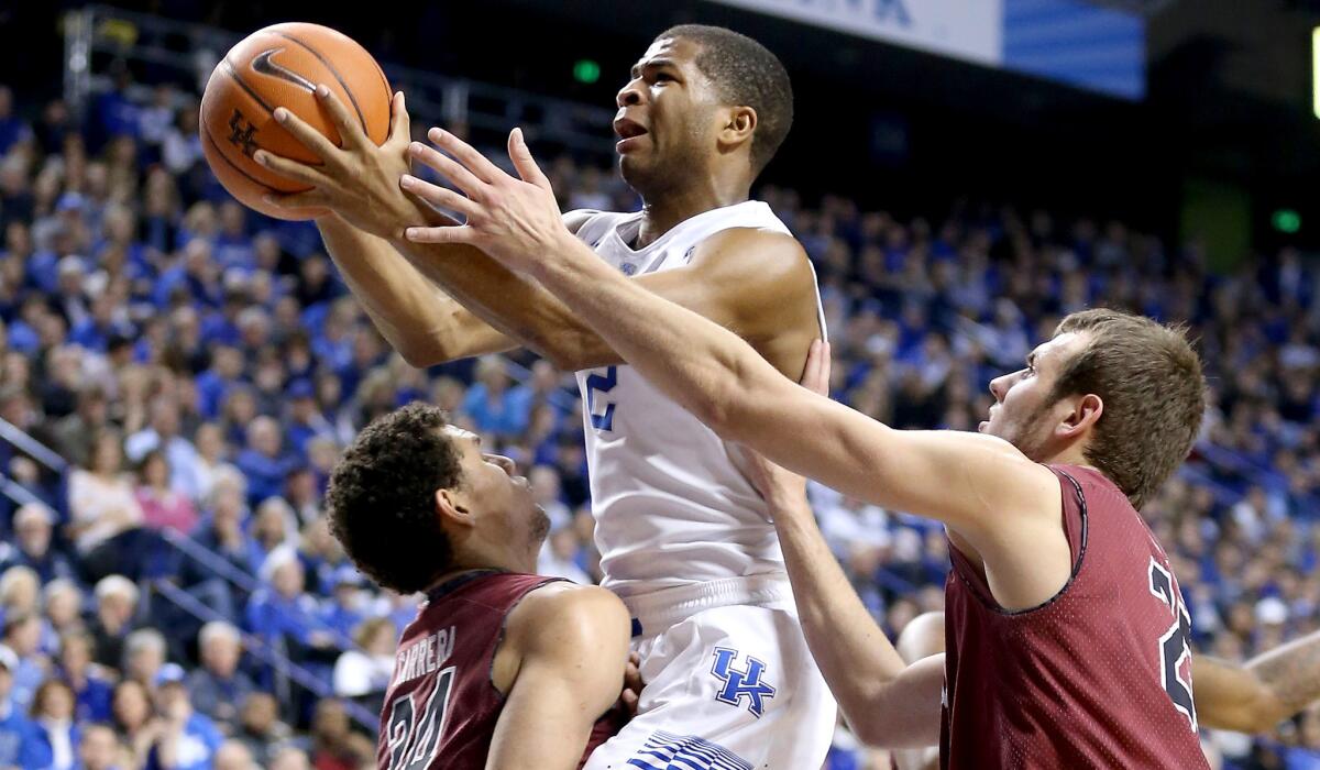 Kentucky guard Aaron Harrison drives to the basket against South Carolina on Saturday.