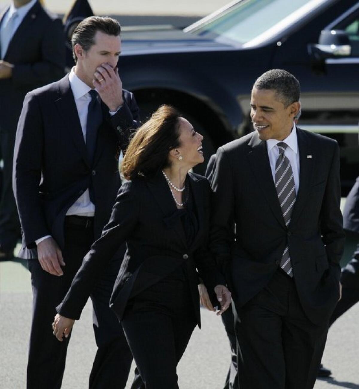 President Obama arrives at San Francisco International Airport and is greeted by California Atty. Gen. Kamala Harris and Lt. Gov. Gavin Newsom. The president was at an Atherton fundraiser when he joked about Harris as the nation's "best-looking" attorney general.
