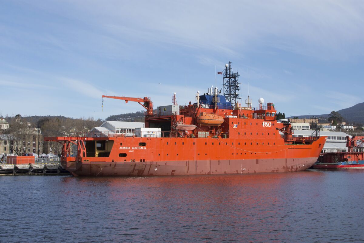 This Aug. 20, 2016, photo shows Australian icebreaker the Aurora Australis docked at Franklin Wharf in Hobart, Australia. The giant orange icebreaker Aurora Australis left Australia for the final time on Saturday, Dec. 12, 2020, after more than 150 trips to Antarctica. Next stop: a shipyard in Dubai, where it will be refurbished and either leased or sold. (Sarah Motherwell/AAP Image via AP)