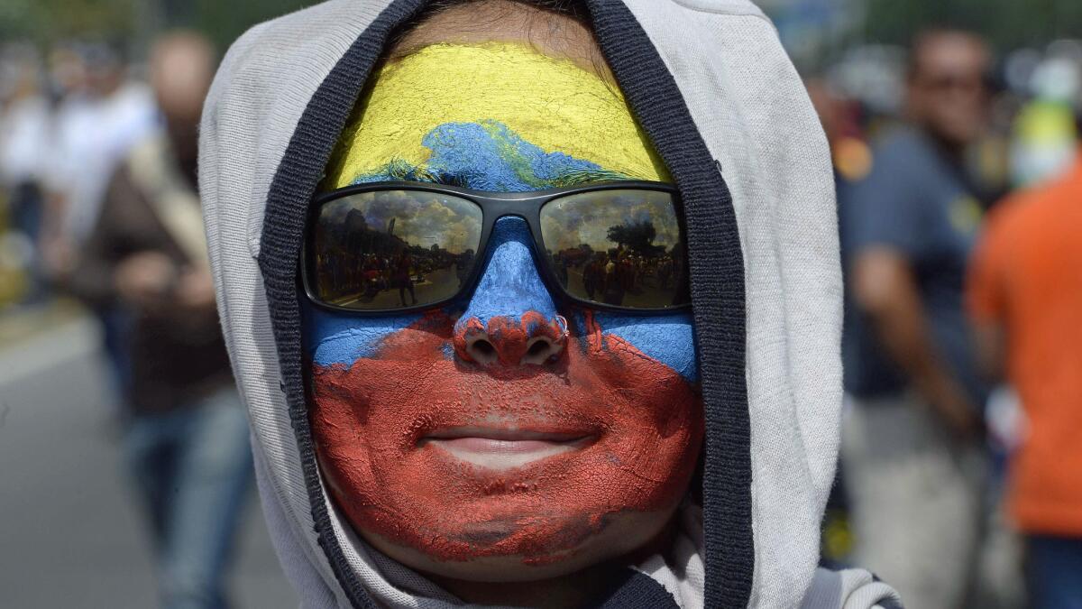 A Venezuelan opposition activist demonstrates against President Nicolas Maduro in Caracas, on April 24, 2017. Protesters rallied on Monday vowing to block Venezuela's main roads to raise pressure on Maduro after three weeks of deadly unrest that have left 21 people dead. Riot police fired rubber bullets and tear gas to break up one of the first rallies in eastern Caracas early Monday while other groups were gathering elsewhere, the opposition said. / AFP PHOTO / Federico PARRAFEDERICO PARRA/AFP/Getty Images ** OUTS - ELSENT, FPG, CM - OUTS * NM, PH, VA if sourced by CT, LA or MoD **