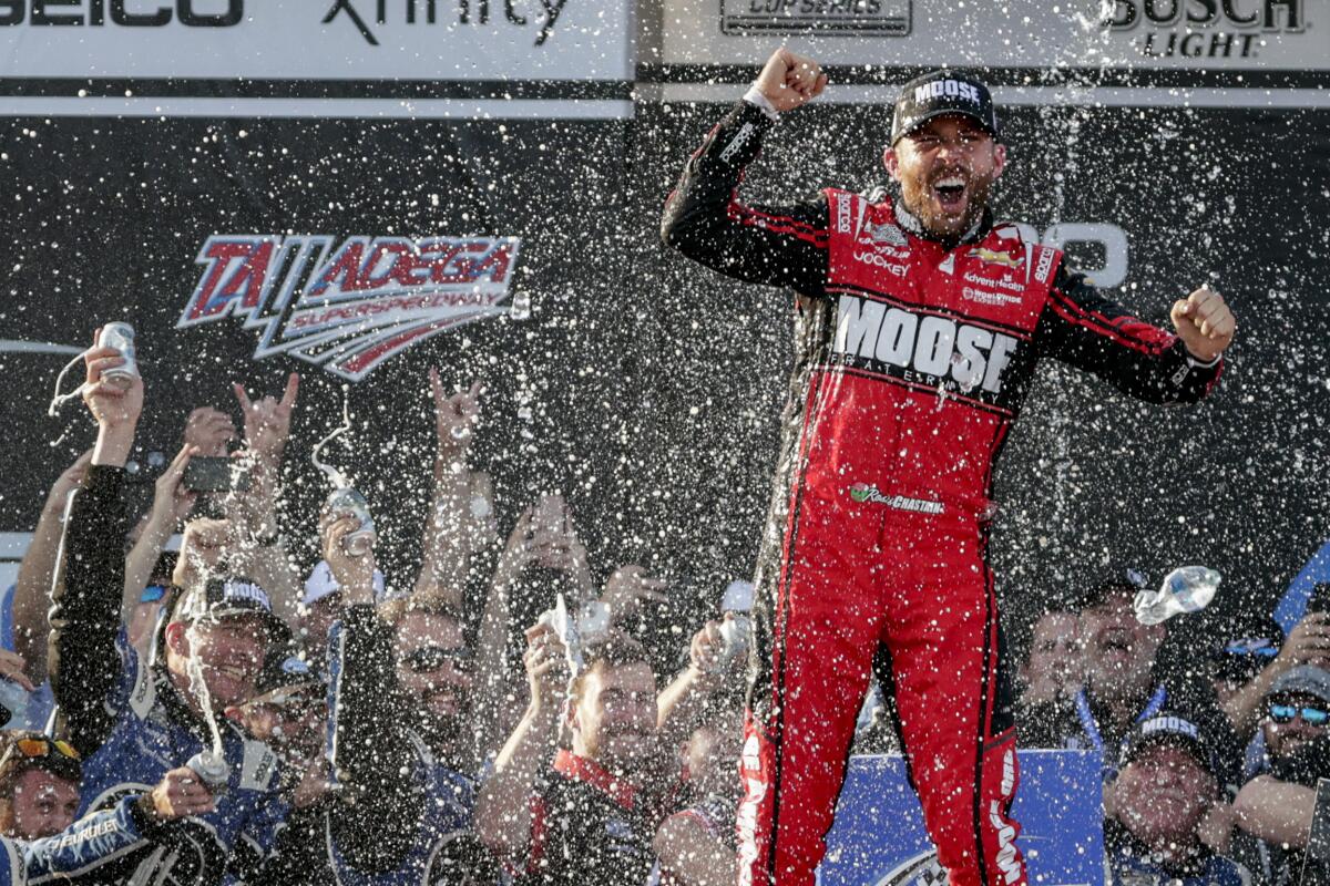 Driver Ross Chastain celebrates the win in Victory Lane following a NASCAR Cup Series race.