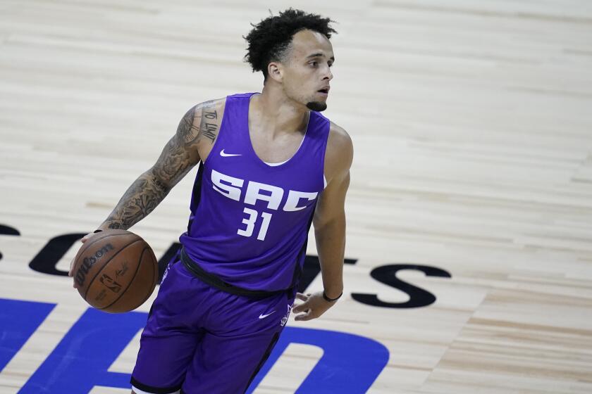 Sacramento Kings' Marcus Graves plays against Boston Celtics during the second half of the NBA summer league championship basketball game Tuesday, Aug. 17, 2021, in Las Vegas. (AP Photo/John Locher)