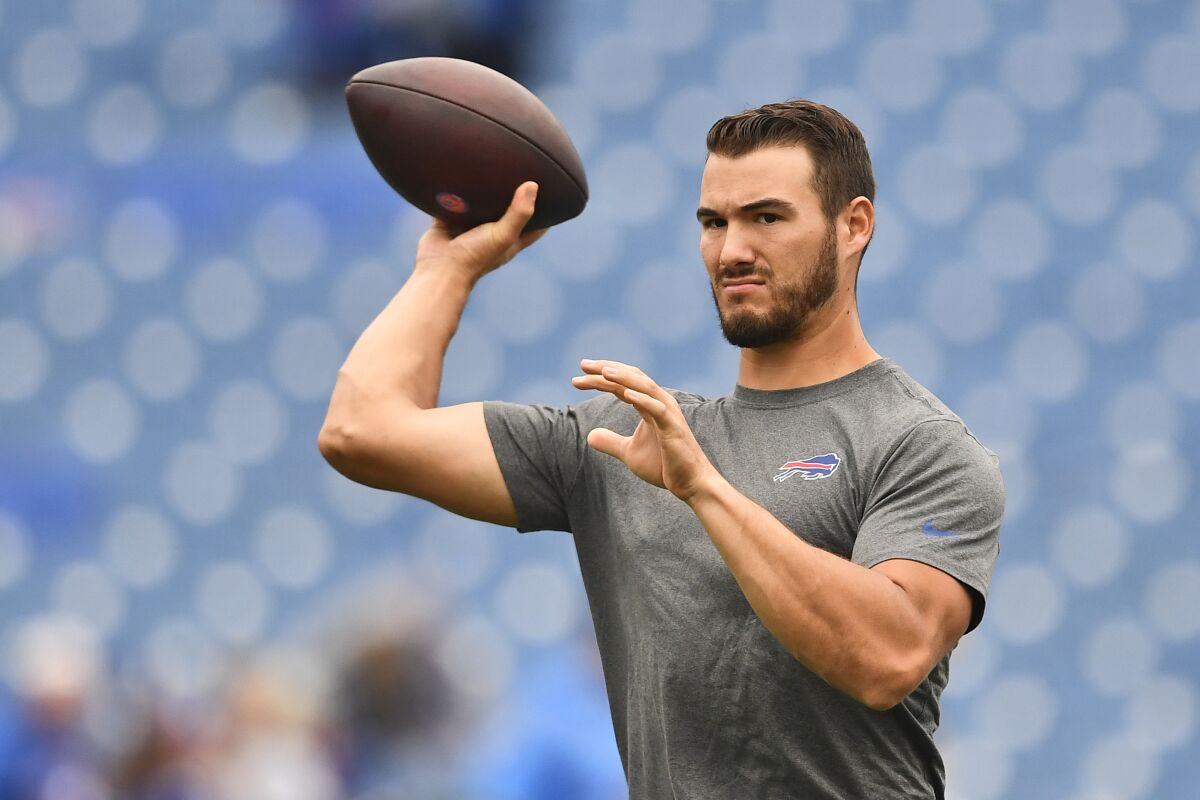FILE - Buffalo Bills quarterback Mitchell Trubisky warms up before an NFL football game against the Houston Texans, Sunday, Oct. 3, 2021, in Orchard Park, N.Y. A person with knowledge of the deal tells The Associated Press the Pittsburgh Steelers have agreed to terms on a two-year contract that will give Trubisky a chance to compete for the starting quarterback job following Roethlisberger's retirement in January. The person spoke to the AP on the condition of anonymity because the deal was not yet official. Financial details were not disclosed. (AP Photo/Adrian Kraus, File)