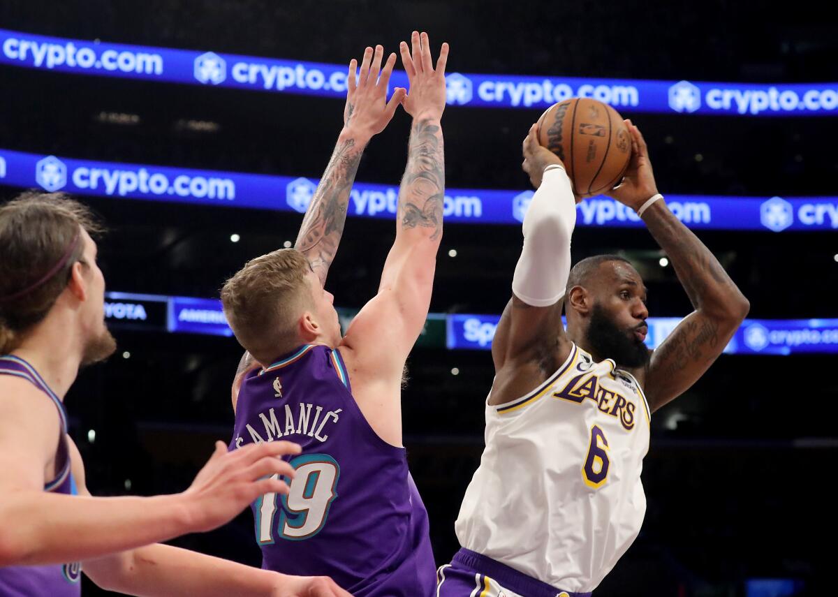 Lakers forward LeBron James looks to pass during the fourth quarter of a 128-117 victory over the Utah Jazz.