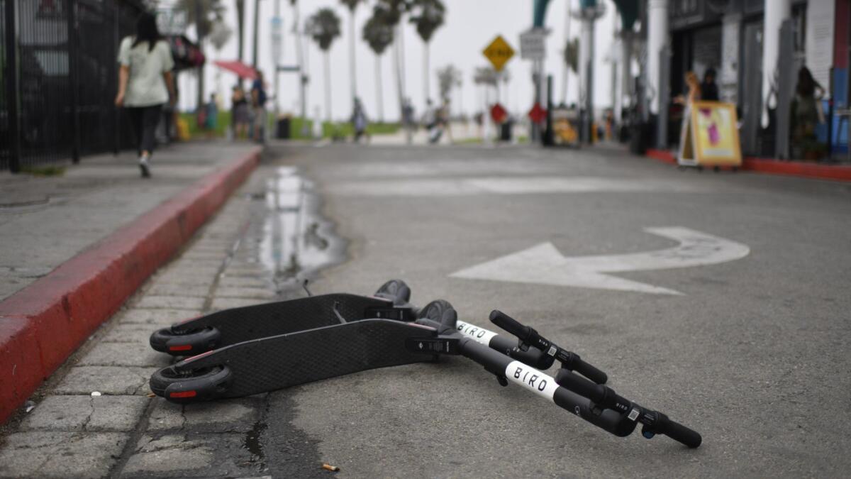 A pair of Bird scooters left on the street in Los Angeles, where city officials on Wednesday announced their first conviction against a rider for scooting under the influence.