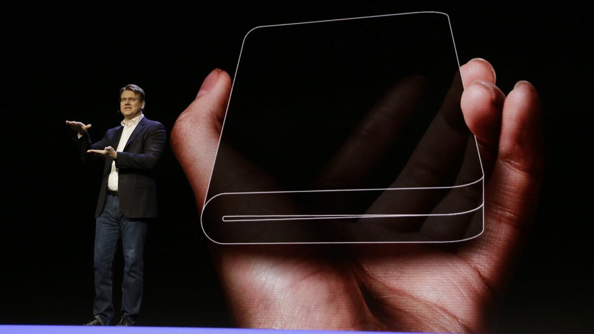 Samsung executive Justin Denison talks about the Infinity Flex Display folding smartphone at the Samsung Developer Conference in San Francisco.