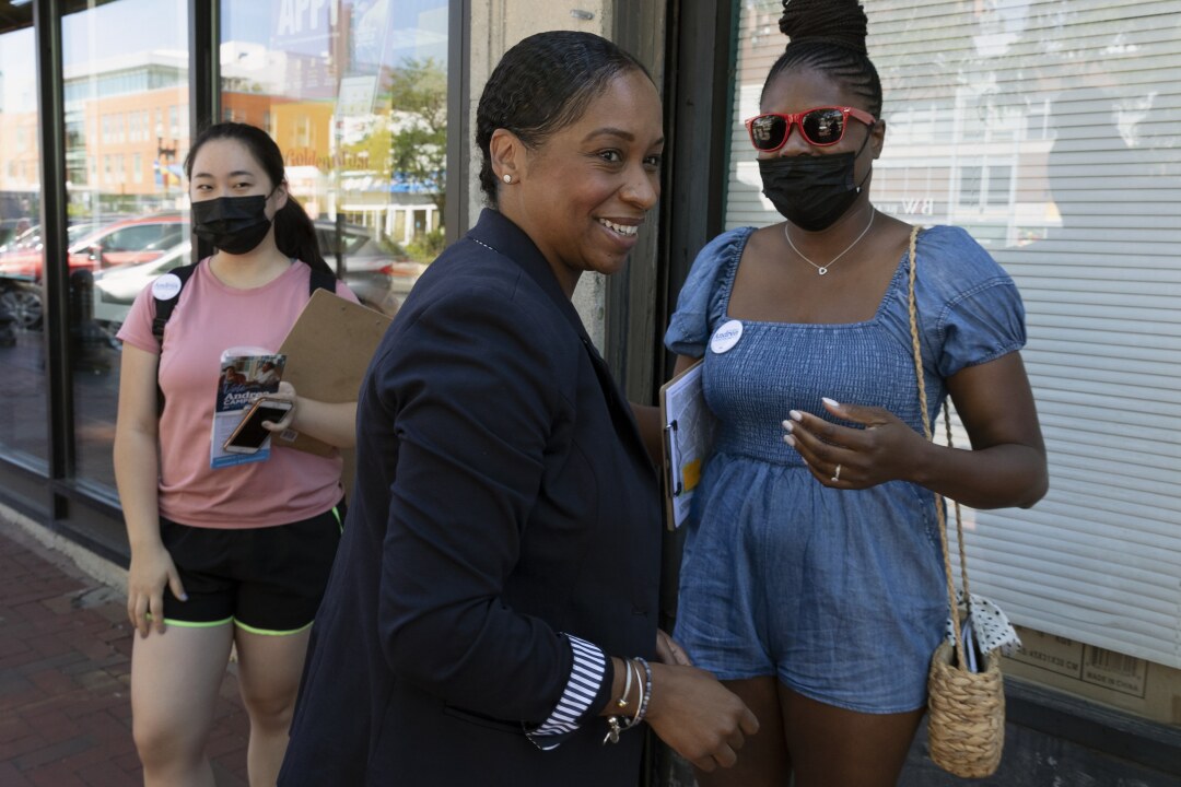 Boston mayoral candidate Andrea Campbell, center, greets volunteers at the launch of a canvassing campaign.