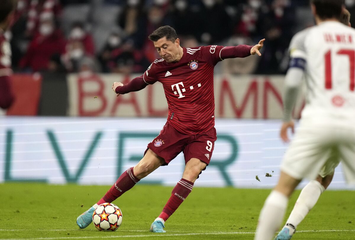 Bayern's Robert Lewandowski shoots on goal during the Champions League, round of 16, second leg soccer match between Bayern and Salzburg in Munich, Germany, Tuesday, March 8, 2022. (AP Photo/Matthias Schrader)